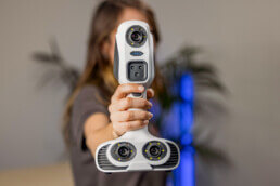 Person holding iReal 2E 3D Colour Scanner Front View | T3DMC