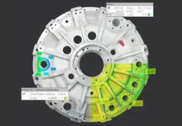 Engineered metal component with 3D scan inspection overlay highlighting flatness and dimensional tolerances using a colour map for quality assurance.